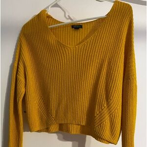 Yellow knitted sweater